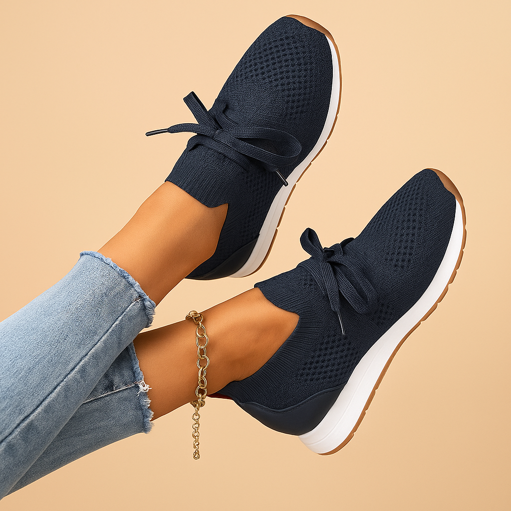 Women’s lace-up shoes with breathable mesh, cushioned rubber sole, and rounded toe in black, grey, brown, and red, ideal for daily comfort.