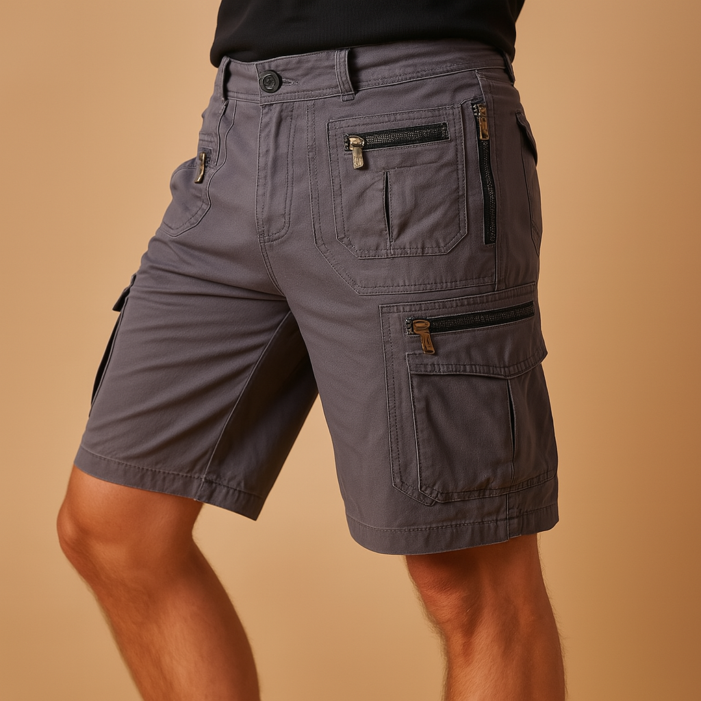 Men’s knee-length cargo shorts with multiple zip and flap pockets in sand, army green, black, and dark grey, ideal for outdoor and casual wear.