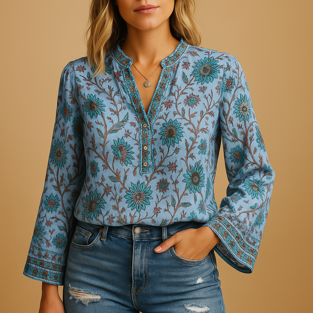 Airy spring blouse for women with a round neckline and flowy fit, ideal for warm-weather occasions and stylish everyday outfits.