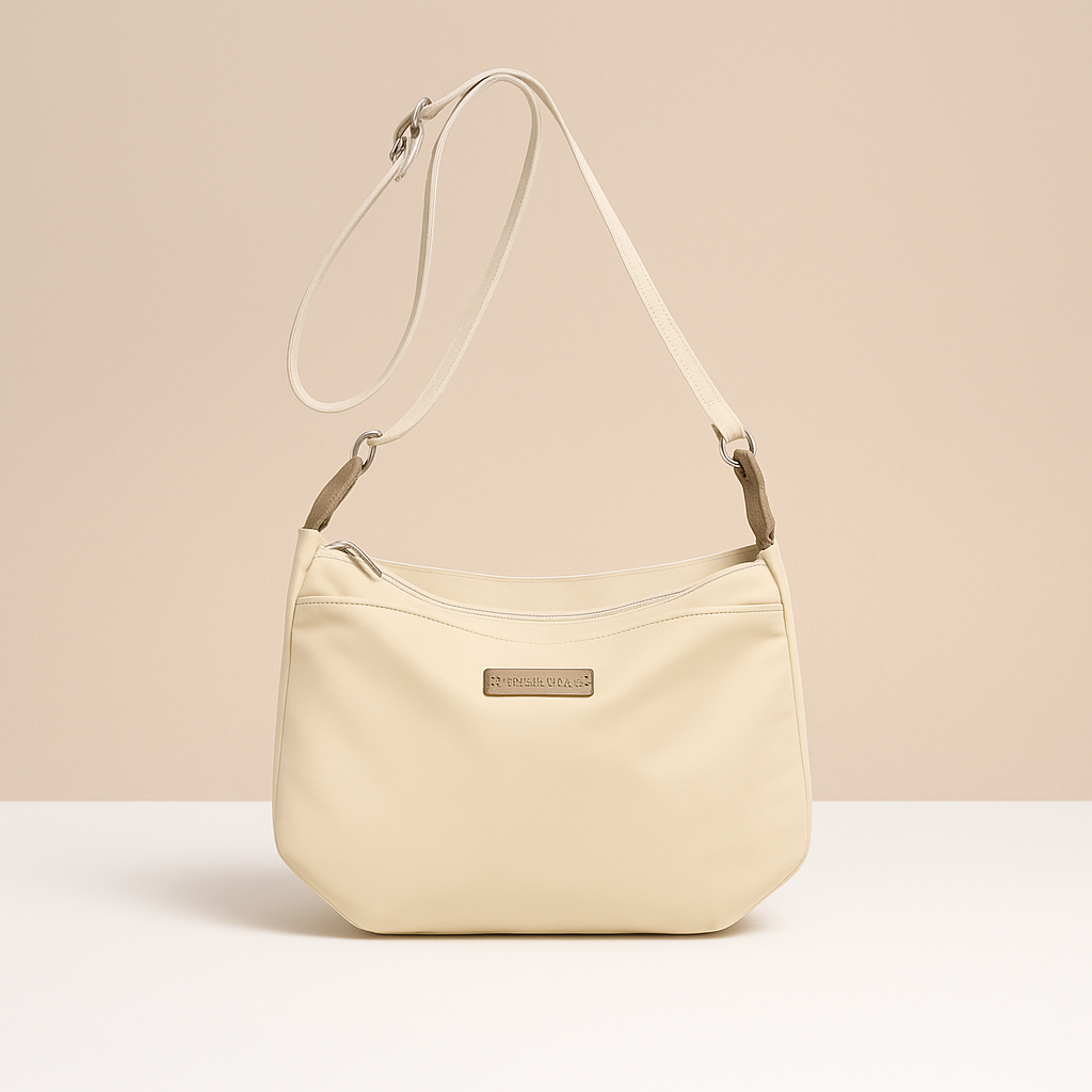 Waterproof anti-theft crossbody travel bag for women with wide strap, secure zip, and functional compartments for commuting or travel.