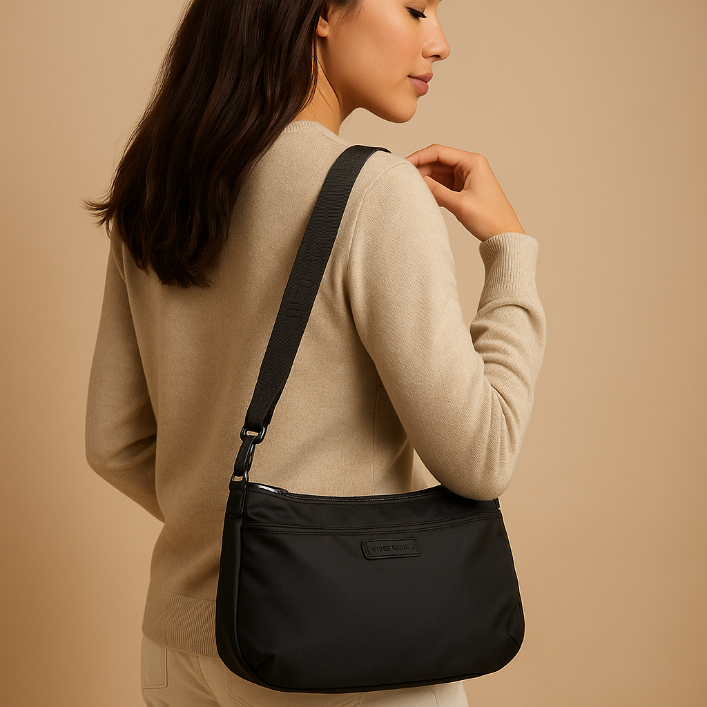Waterproof anti-theft crossbody travel bag for women with wide strap, secure zip, and functional compartments for commuting or travel.