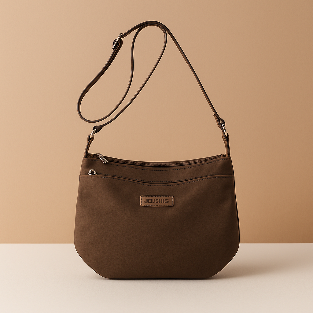 Waterproof anti-theft crossbody travel bag for women with wide strap, secure zip, and functional compartments for commuting or travel.