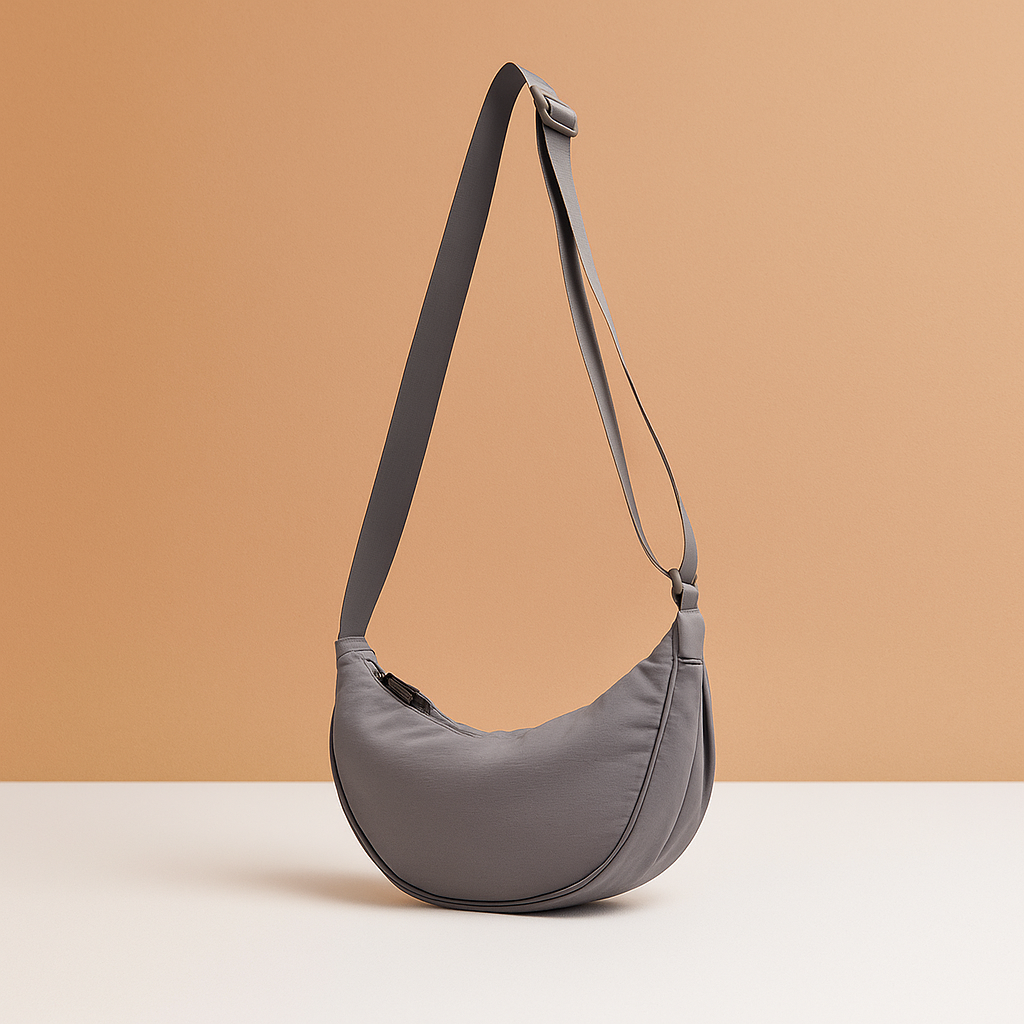 Anti-theft dumpling crossbody bag for women with ergonomic design, zippered closures, and secure strap for stylish daily wear and travel.