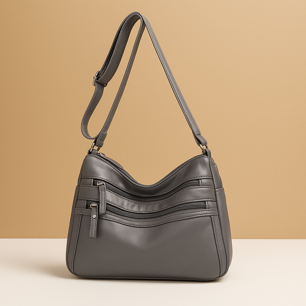 Compact anti-theft crossbody bag for women with secure zip closures, adjustable strap, and water-resistant design for everyday use.
