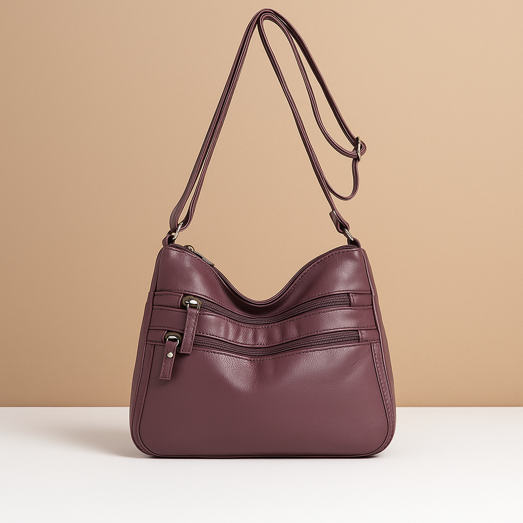 Compact anti-theft crossbody bag for women with secure zip closures, adjustable strap, and water-resistant design for everyday use.