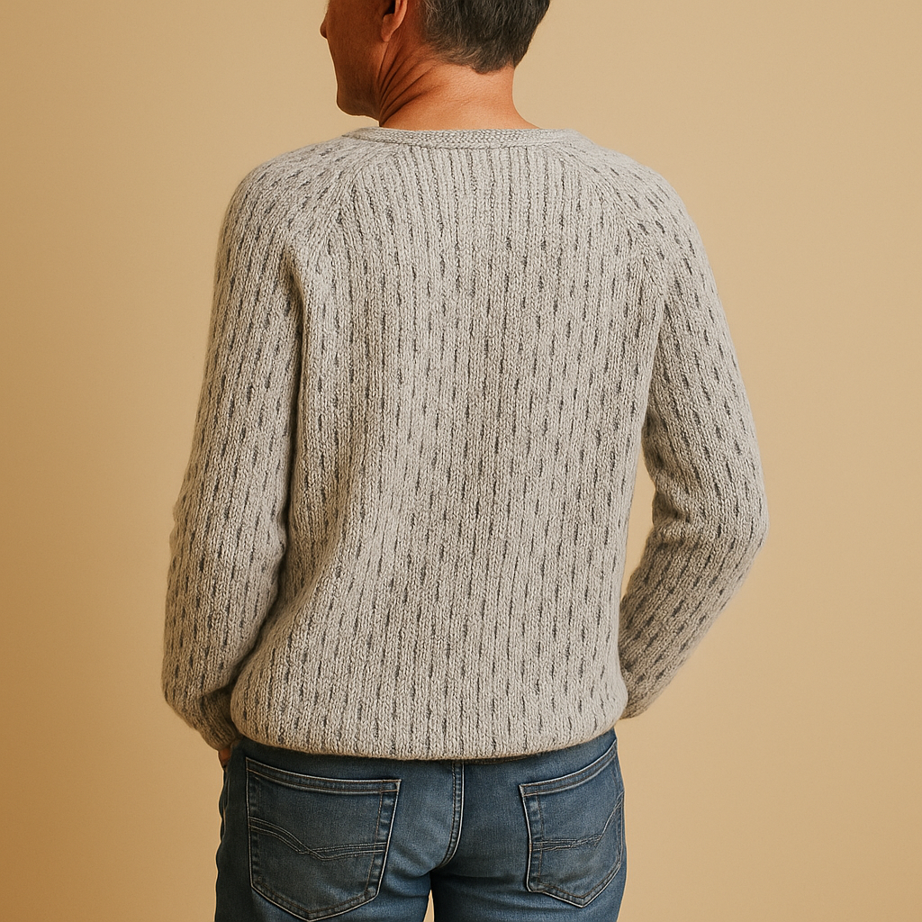 Women’s elegant grey knitted winter sweater with a soft breathable fit, perfect for layering during cold weather or wearing on its own.