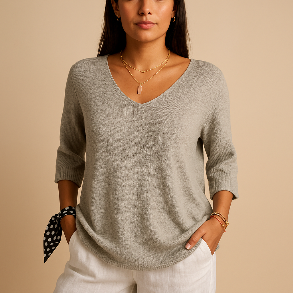 Relaxed elegant top for women in soft neutral tones with a modern fit, perfect for casual wear or at-home comfort.