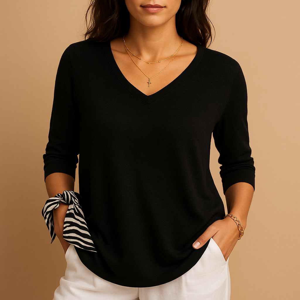 Relaxed elegant top for women in soft neutral tones with a modern fit, perfect for casual wear or at-home comfort.