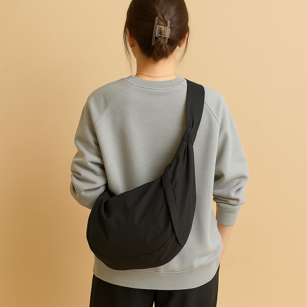 Spacious puffer crossbody bag for women with water-resistant finish, thick shoulder strap, and roomy interior—ideal for travel and everyday use.