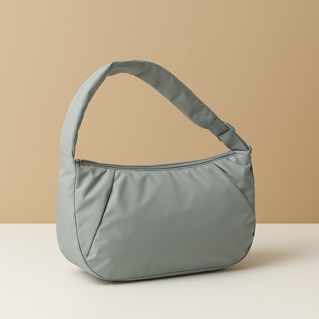 Spacious puffer crossbody bag for women with water-resistant finish, thick shoulder strap, and roomy interior—ideal for travel and everyday use.