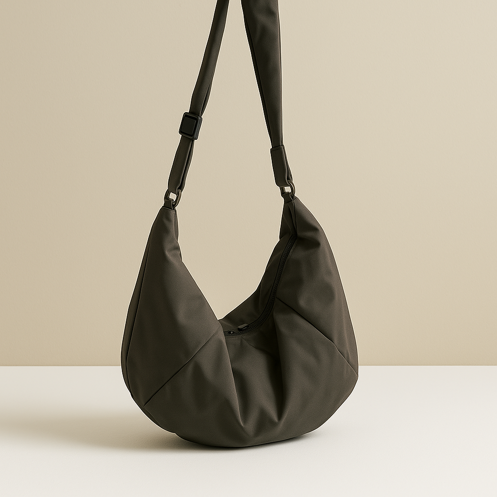 Spacious puffer crossbody bag for women with water-resistant finish, thick shoulder strap, and roomy interior—ideal for travel and everyday use.