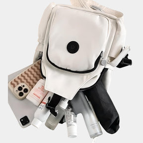 Women’s anti-theft crossbody travel bag with multiple compartments, secure front clip, and lightweight design for daily use or travel.