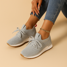 Women’s lace-up shoes with breathable mesh, cushioned rubber sole, and rounded toe in black, grey, brown, and red, ideal for daily comfort.