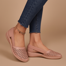 Women’s breathable slip-on shoes with cut-out details, flexible lightweight sole, and casual summer style in a comfortable design.