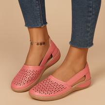 Women’s breathable slip-on shoes with cut-out details, flexible lightweight sole, and casual summer style in a comfortable design.