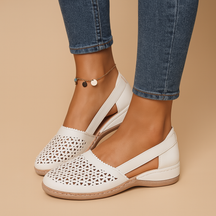 Women’s breathable slip-on shoes with cut-out details, flexible lightweight sole, and casual summer style in a comfortable design.