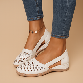 Women’s breathable slip-on shoes with cut-out details, flexible lightweight sole, and casual summer style in a comfortable design.