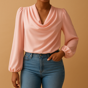 Woman wearing a beige chiffon blouse with puff sleeves and V-neck, ideal for warm weather and stylish summer looks