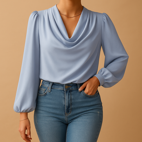 Woman wearing a beige chiffon blouse with puff sleeves and V-neck, ideal for warm weather and stylish summer looks