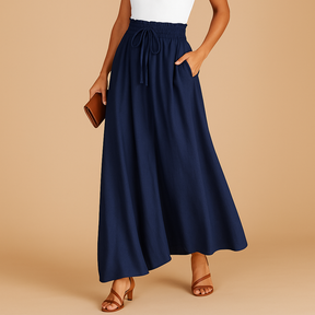 Women’s high-waisted wide-leg trousers with elastic waistband and modern chic cut, perfect for work or casual days