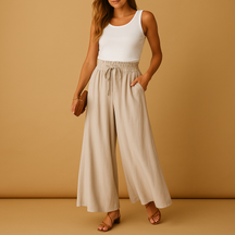 Women’s high-waisted wide-leg trousers with elastic waistband and modern chic cut, perfect for work or casual days