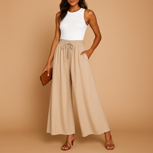 Women’s high-waisted wide-leg trousers with elastic waistband and modern chic cut, perfect for work or casual days