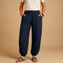 Women’s high-waisted linen boho trousers with a loose fit and functional pockets, ideal for summer days and relaxed outfits