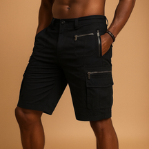 Men’s knee-length cargo shorts with multiple zip and flap pockets in sand, army green, black, and dark grey, ideal for outdoor and casual wear.