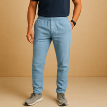 Men’s lightweight breathable trousers in relaxed fit, available in beige and sand, ideal for summer days, beachwear, and casual elegance.