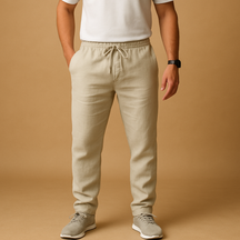 Men’s lightweight breathable trousers in relaxed fit, available in beige and sand, ideal for summer days, beachwear, and casual elegance.