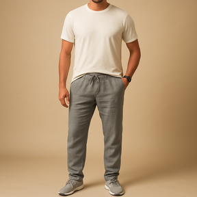 Men’s lightweight breathable trousers in relaxed fit, available in beige and sand, ideal for summer days, beachwear, and casual elegance.