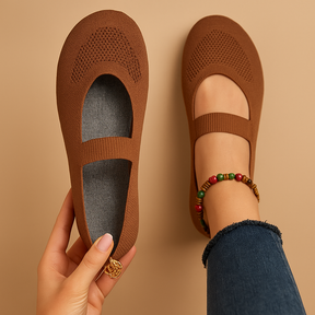 Women’s lightweight slip-on shoes with breathable perforations, cushioned insole, and non-slip sole in black, light grey, and blue.