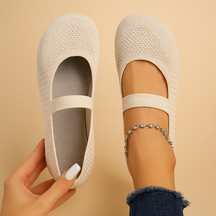 Women’s lightweight slip-on shoes with breathable perforations, cushioned insole, and non-slip sole in black, light grey, and blue.