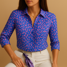 Woman wearing a lightweight printed blouse with a bold design, perfect for casual days, work, or elegant evenings