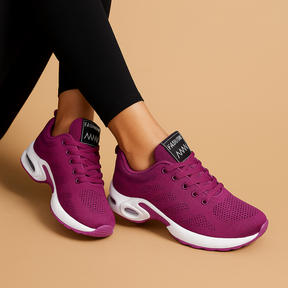 Breathable lightweight running sneakers for women in white, black, pink, and blue, ideal for fitness, walking, and casual wear.