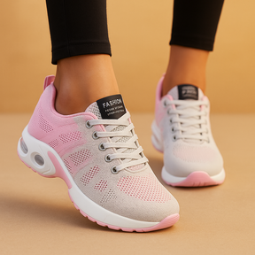Breathable lightweight running sneakers for women in white, black, pink, and blue, ideal for fitness, walking, and casual wear.