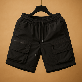 Men’s oversized cargo shorts in lightweight quick-drying nylon with multiple functional pockets, available in brown, black, army green, white, and purple.