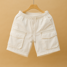 Men’s oversized cargo shorts in lightweight quick-drying nylon with multiple functional pockets, available in brown, black, army green, white, and purple.