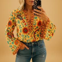 Airy spring blouse for women with a round neckline and flowy fit, ideal for warm-weather occasions and stylish everyday outfits.