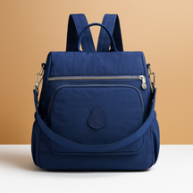 Anti-theft crossbody backpack for women with convertible straps, waterproof nylon material, and hidden compartments for stylish and secure travel.