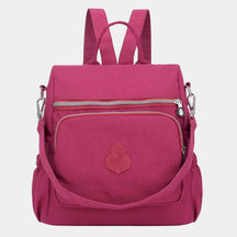 Women’s anti-theft crossbody backpack with hidden zippers, waterproof nylon, and convertible straps—ideal for travel and daily use.