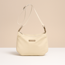 Waterproof anti-theft crossbody travel bag for women with wide strap, secure zip, and functional compartments for commuting or travel.