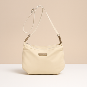 Waterproof anti-theft crossbody travel bag for women with wide strap, secure zip, and functional compartments for commuting or travel.