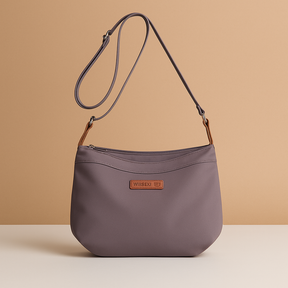 Waterproof anti-theft crossbody travel bag for women with wide strap, secure zip, and functional compartments for commuting or travel.