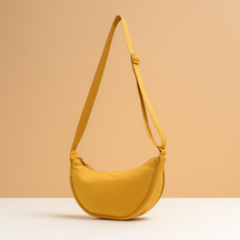 Anti-theft dumpling crossbody bag for women with ergonomic design, zippered closures, and secure strap for stylish daily wear and travel.
