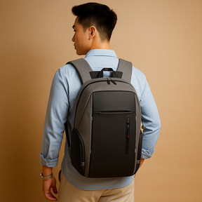 Anti-theft laptop backpack for men with USB charging, night visibility strip, and secure compartments for business and travel use.