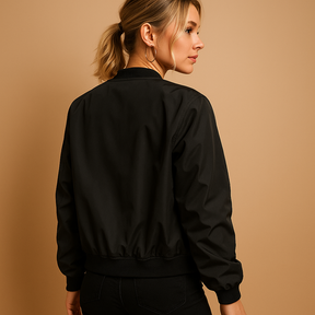 Women’s bomber jacket with ribbed cuffs, zip-up design, and slim fit for casual and stylish everyday wear.