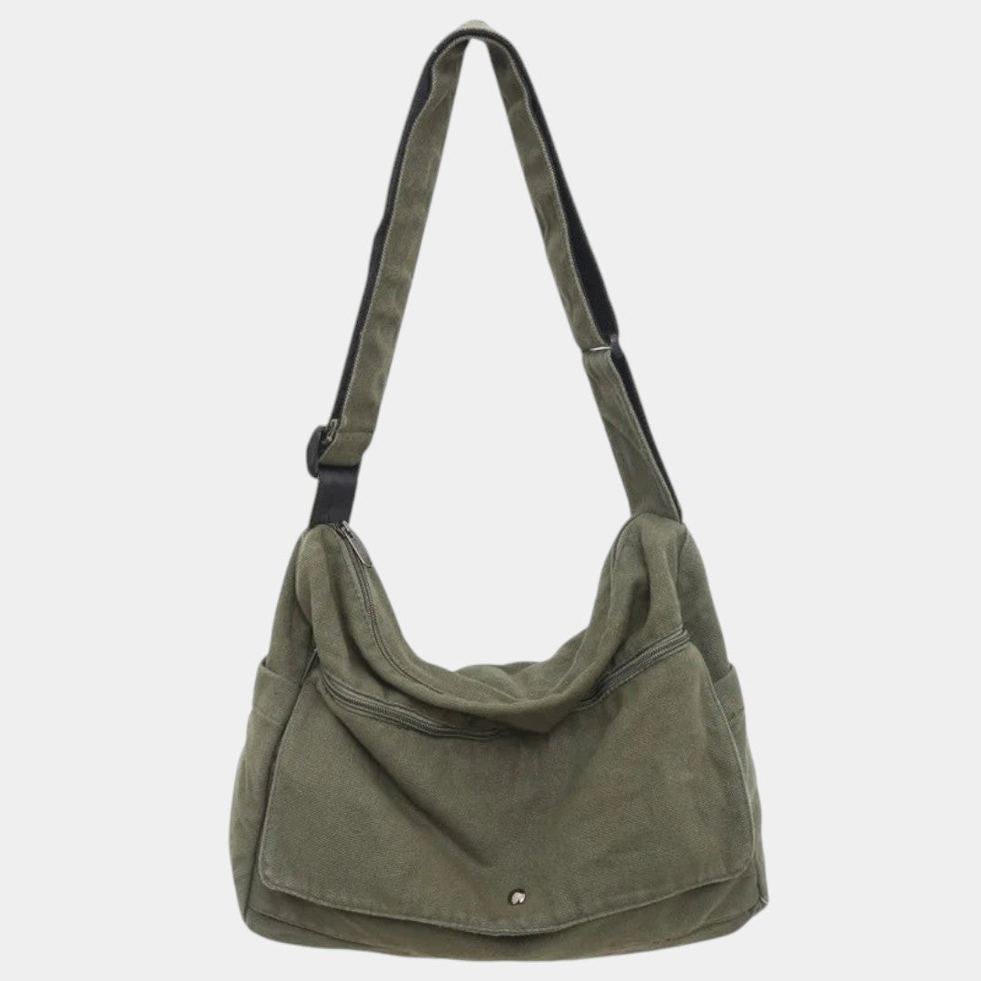 Women’s canvas shoulder bag with adjustable strap, spacious compartments, and minimalist design for daily use