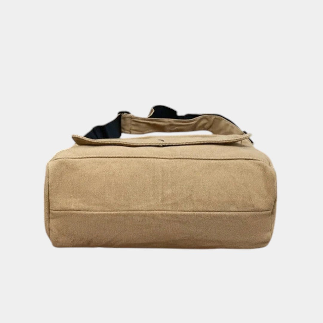 Women’s canvas shoulder bag with adjustable strap, spacious compartments, and minimalist design for daily use