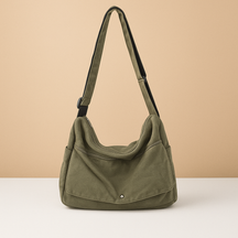 Canvas shoulder bag for women with roomy main compartment, outer pocket, and adjustable strap—ideal for work, travel, or daily use.